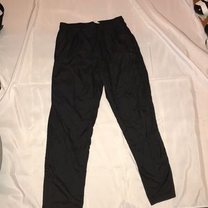 Dark grey adidas pants and with black stripes